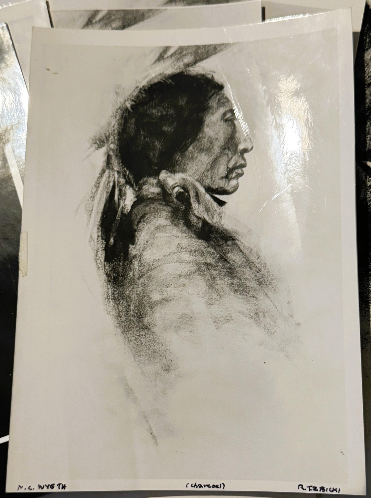Charcoal portrait print of a Native American man in profile facing right, wearing long hair tied back and a collared shirt, o