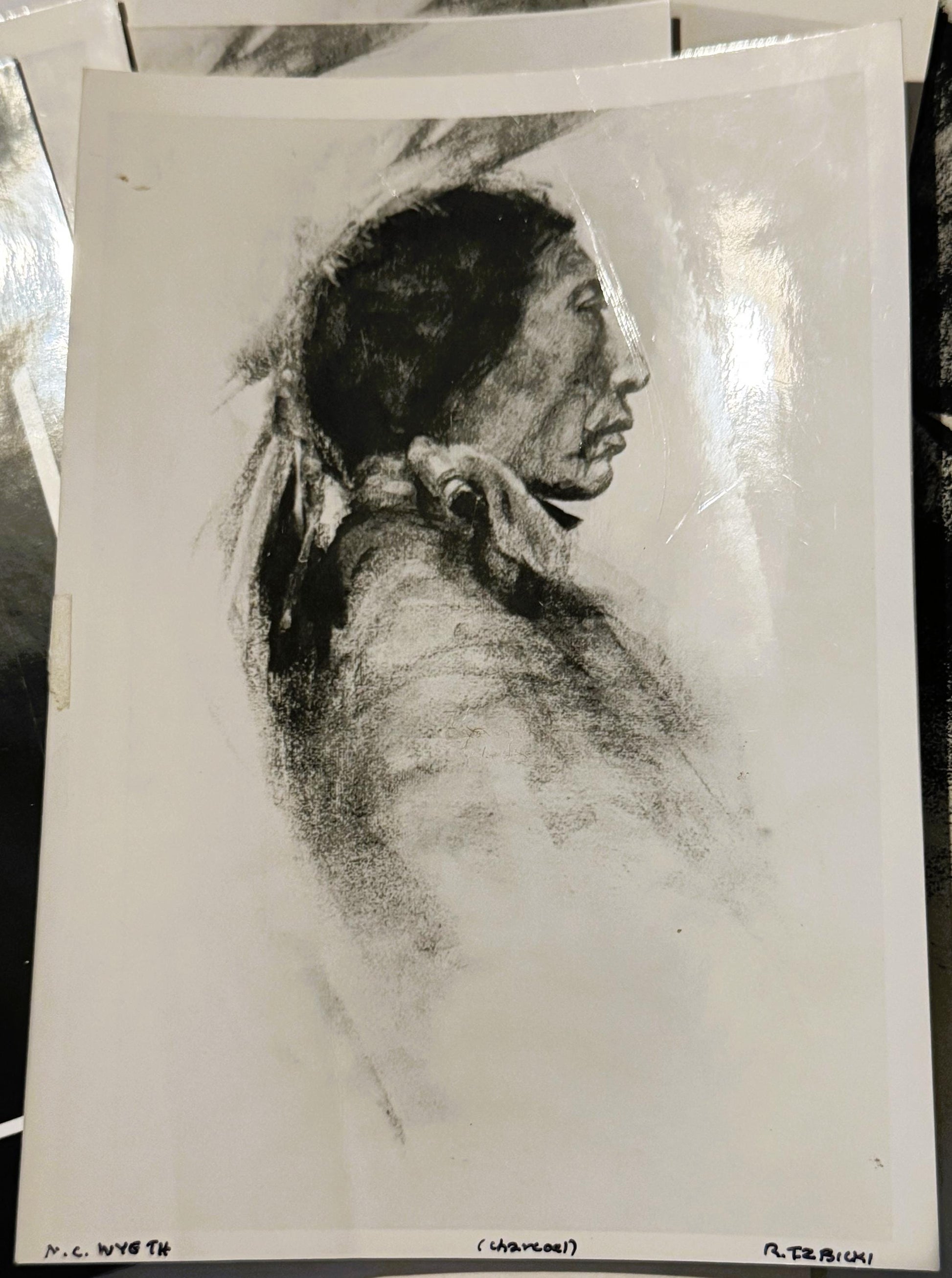 Charcoal portrait print of a Native American man in profile facing right, wearing long hair tied back and a collared shirt, o