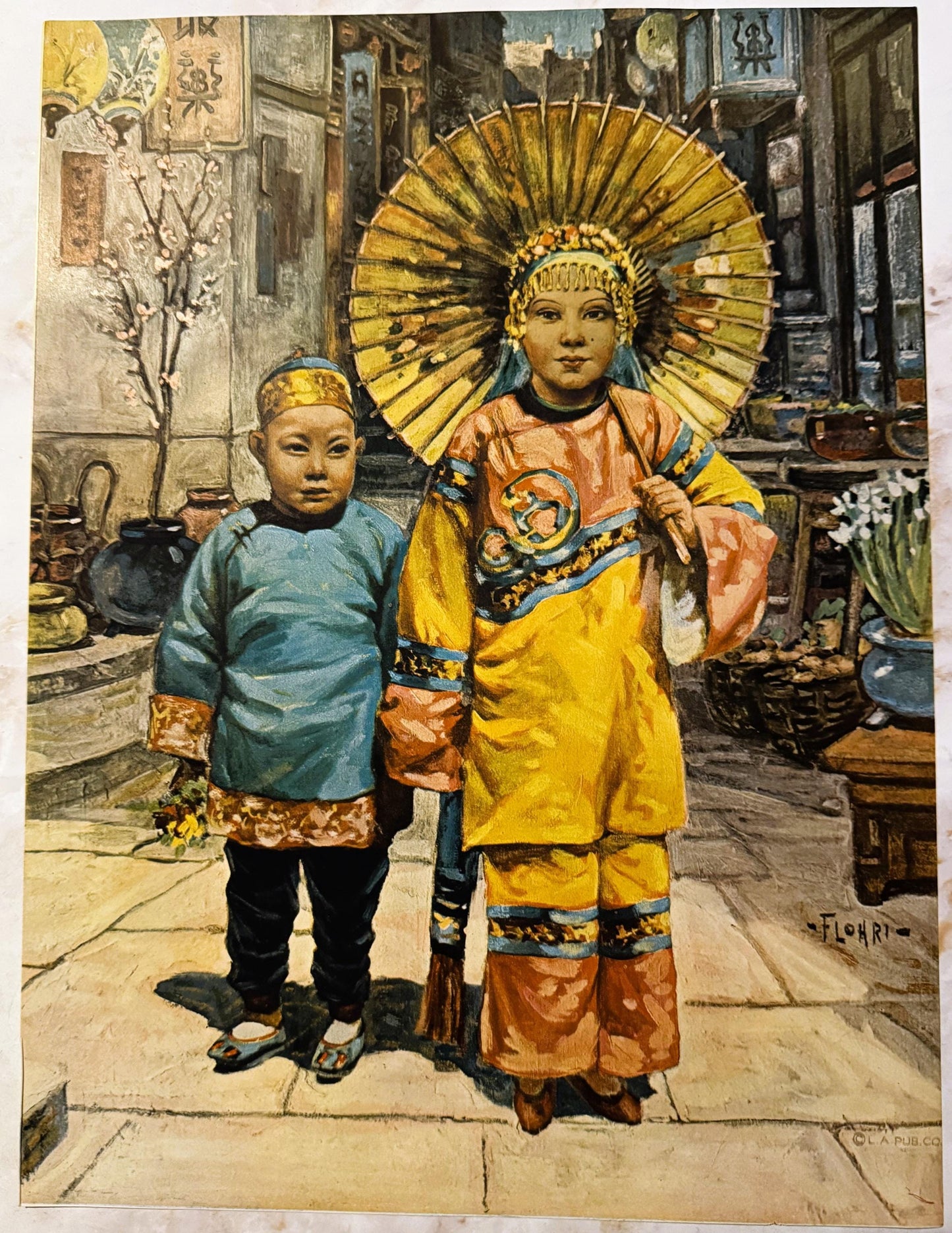 Antique color print depicting two children in elaborate Asian ceremonial costumes standing on a street, one wearing blue and 
