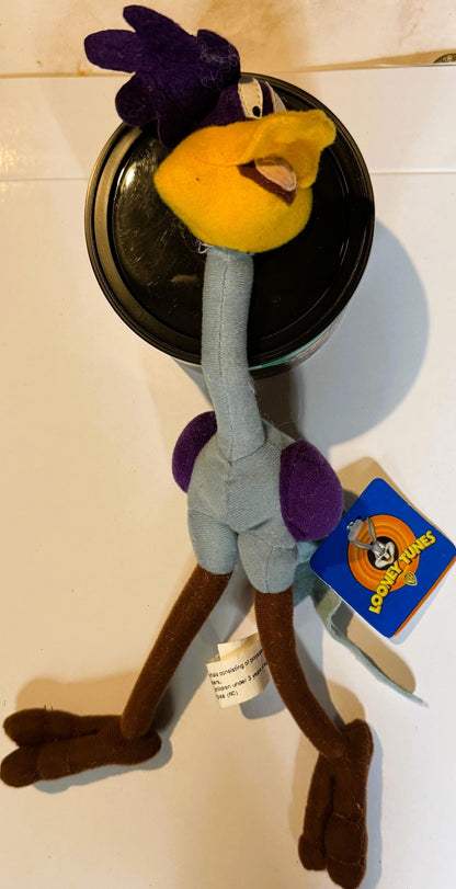 Vintage Road Runner plush toy with yellow beak, purple head, gray body, brown legs, holding black circular mirror, blue Loone