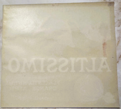 Back of the Altissimo crate label: plain paper with ALTISSIMO and the packer lines showing faintly through in reverse