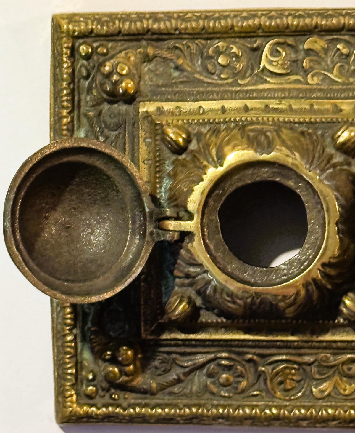 Ornate brass double inkwell with hinged lid from late 19th century desk accessories