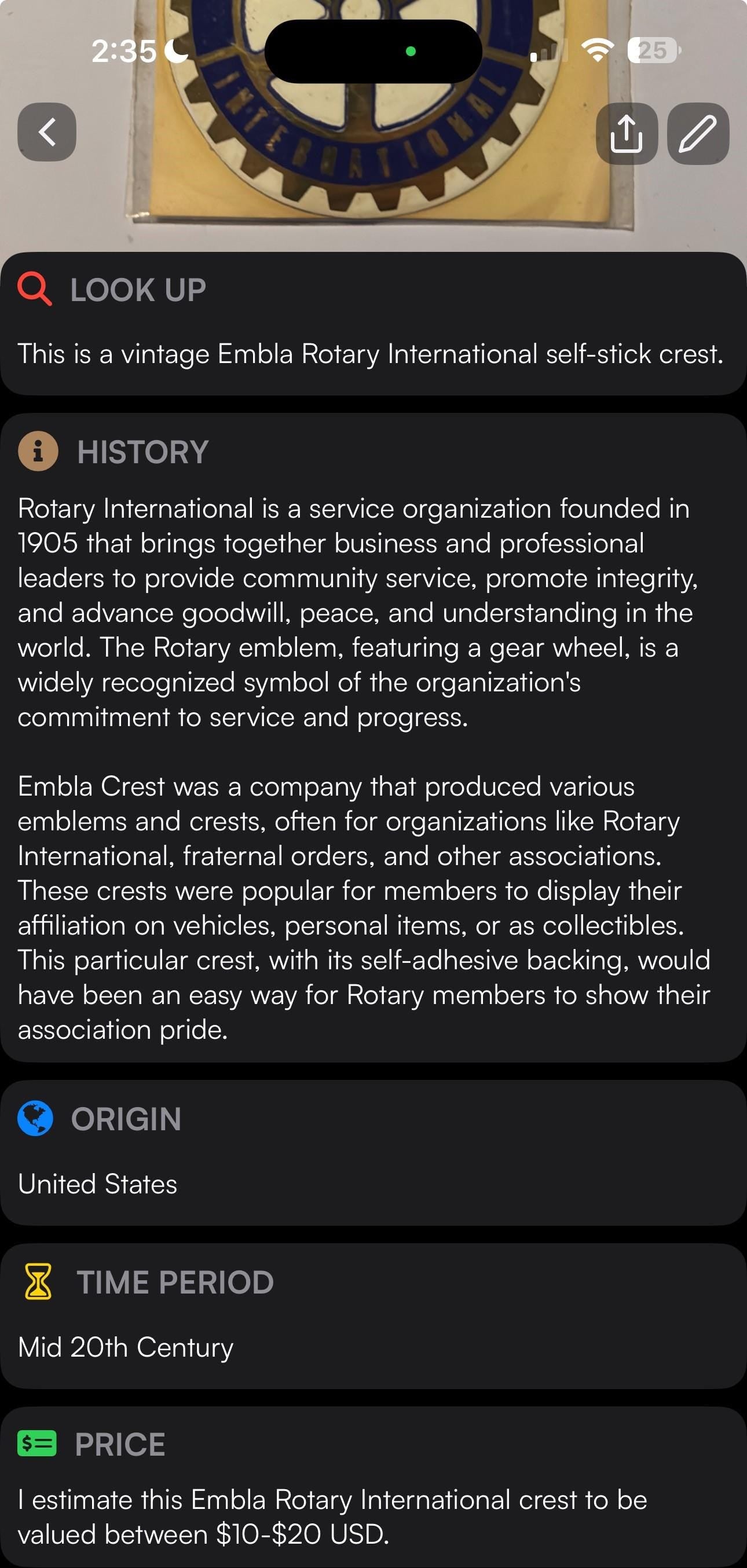 Vintage Embla Rotary International self-stick crest with blue and gold gear wheel emblem on cream background