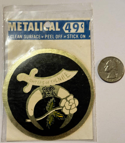 Metallic stick-on decal featuring Daughters of the Nile logo with scimitar and flower on black background, priced 49¢, shown 