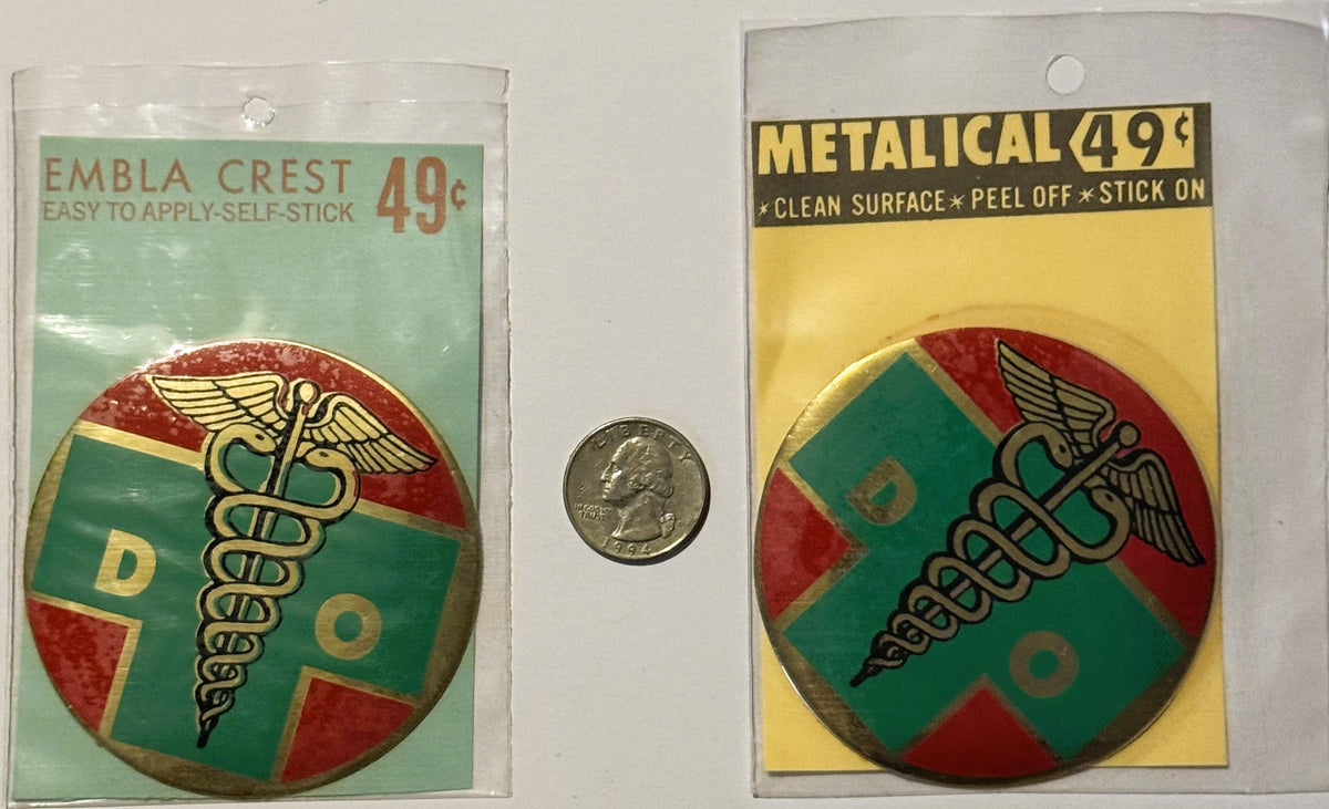Two unopened vintage medical decals with caduceus symbol in red, green and gold; left shows "Embla Crest" at 49¢, right shows