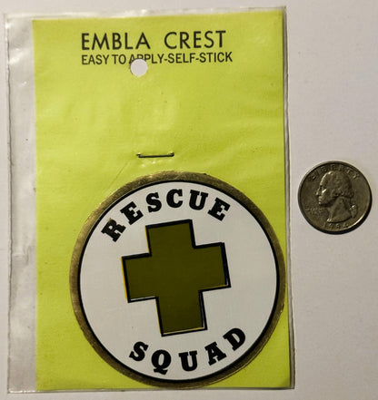 Vintage self-stick embla crest decal showing "Rescue Squad" text around olive cross on white circle, displayed on yellow back