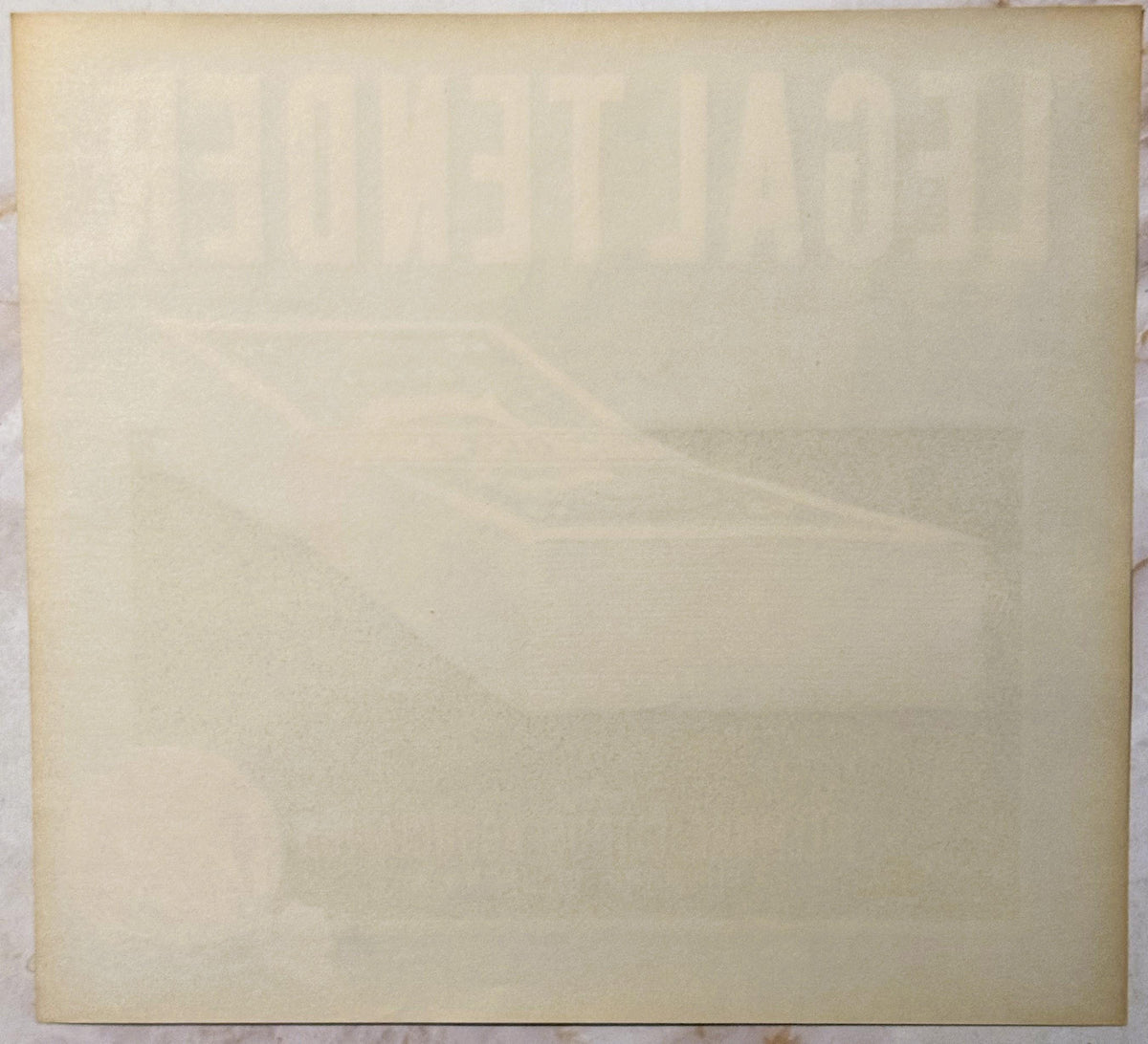 Cream-colored vintage crate label with faint embossed or printed text, shown flat against white surface