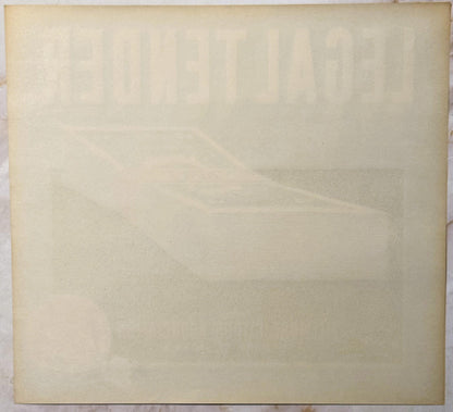 Cream-colored vintage crate label with faint embossed or printed text, shown flat against white surface