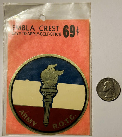 Unopened Army ROTC emblem decal with torch design in red, white, and blue, priced 69¢, shown next to a quarter for scale.
