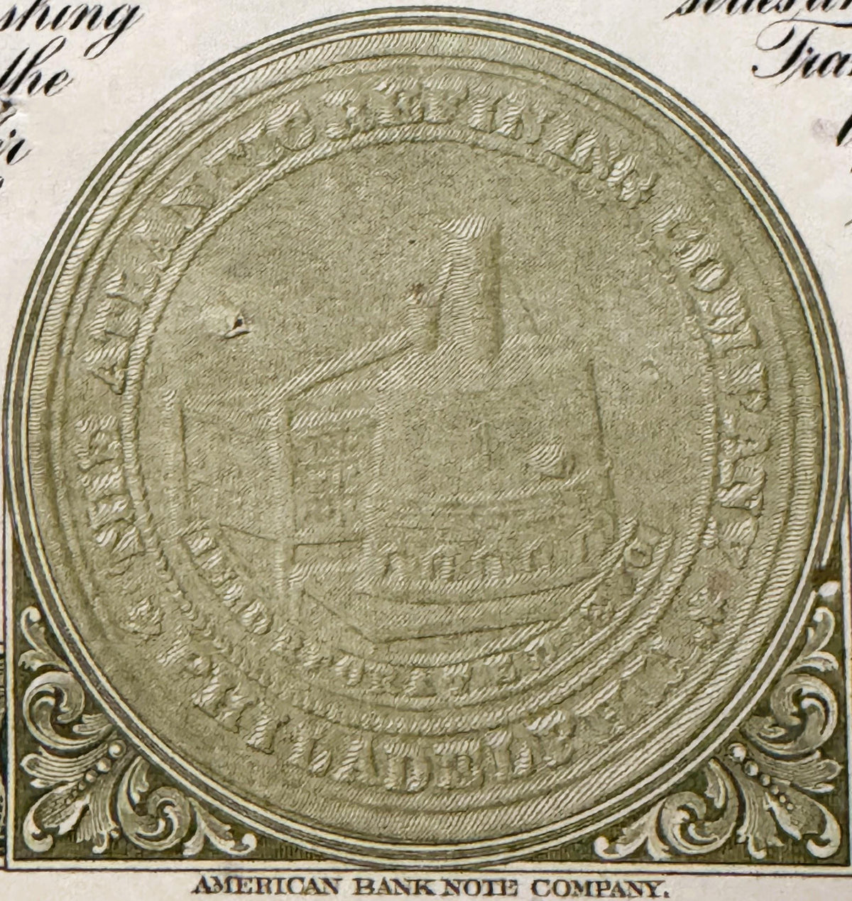 Close-up of ornate circular seal or medallion from vintage stock certificate, embossed with decorative border and central ima