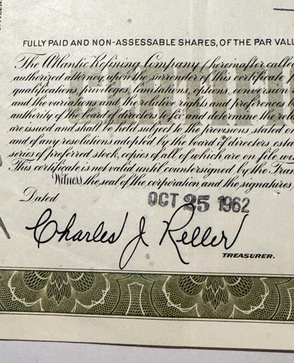 Close-up of stock certificate signature block dated OCT 25, with decorative bor