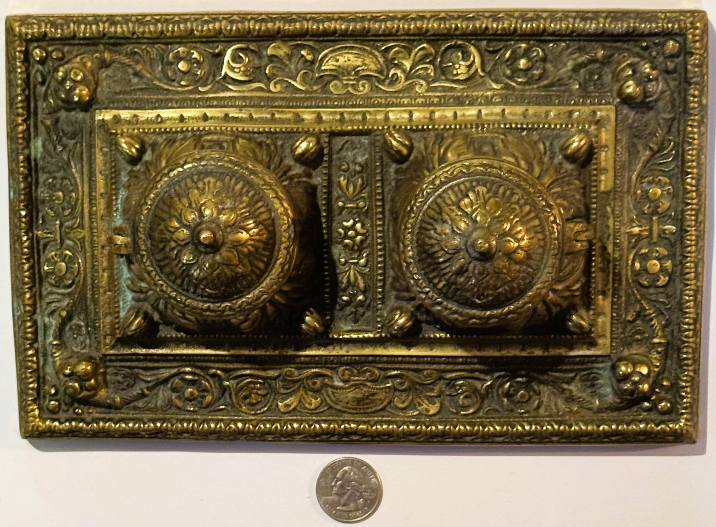 Ornate brass double inkwell desk accessory from late 19th century with floral designs