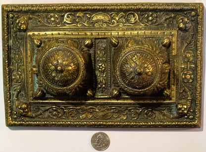 Ornate brass double inkwell desk accessory from late 19th century with floral designs