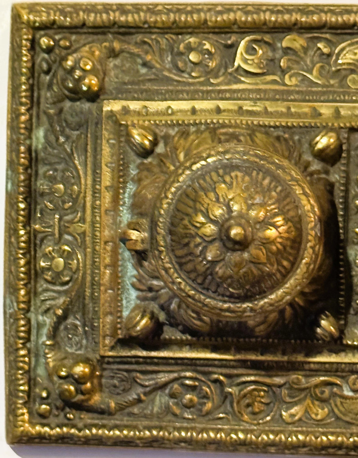 Ornate aged brass double inkwell desk accessory from late 19th century
