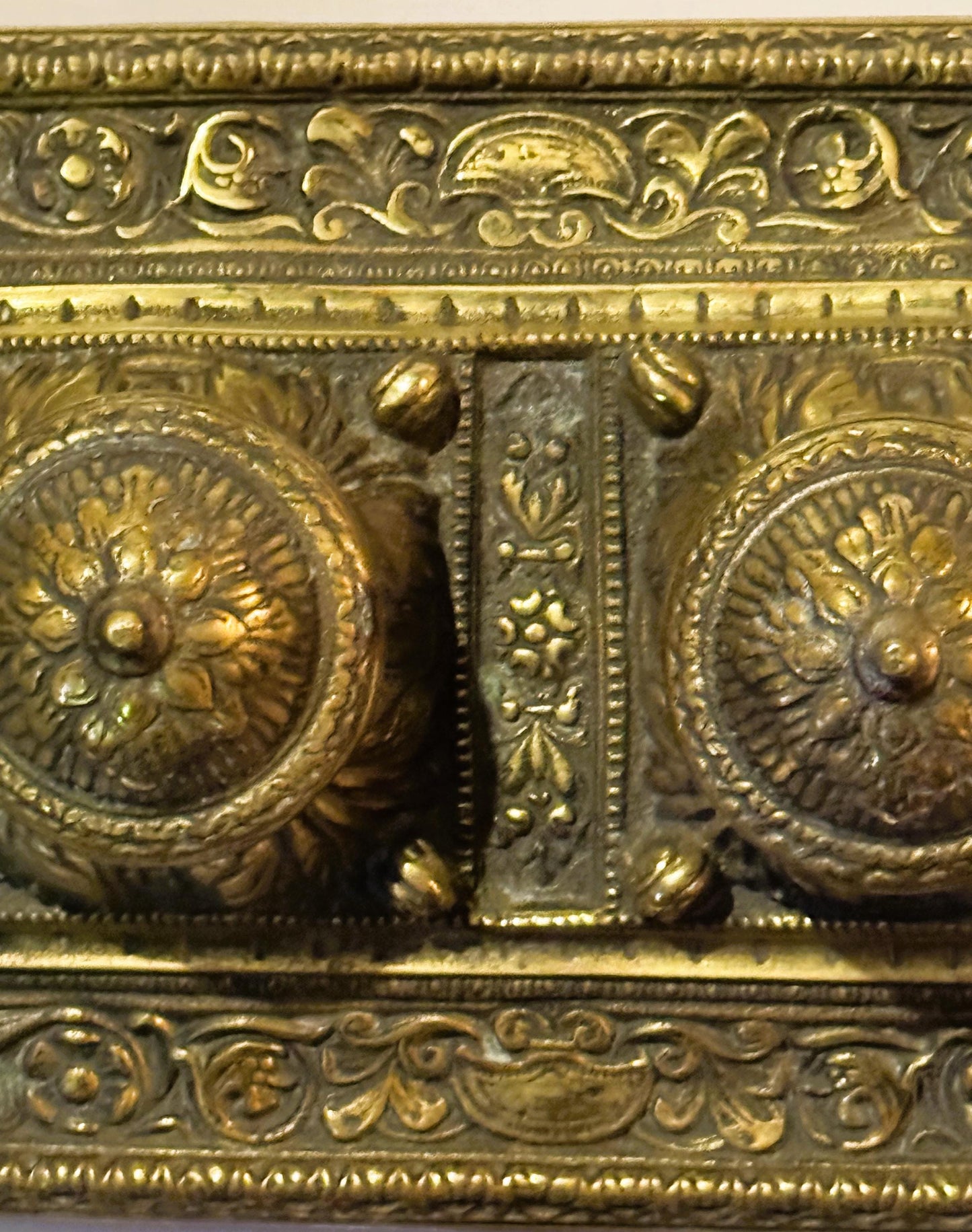 Ornate gold-toned metalwork on Late 19th Century Brass Double Inkwell Desk Accessory