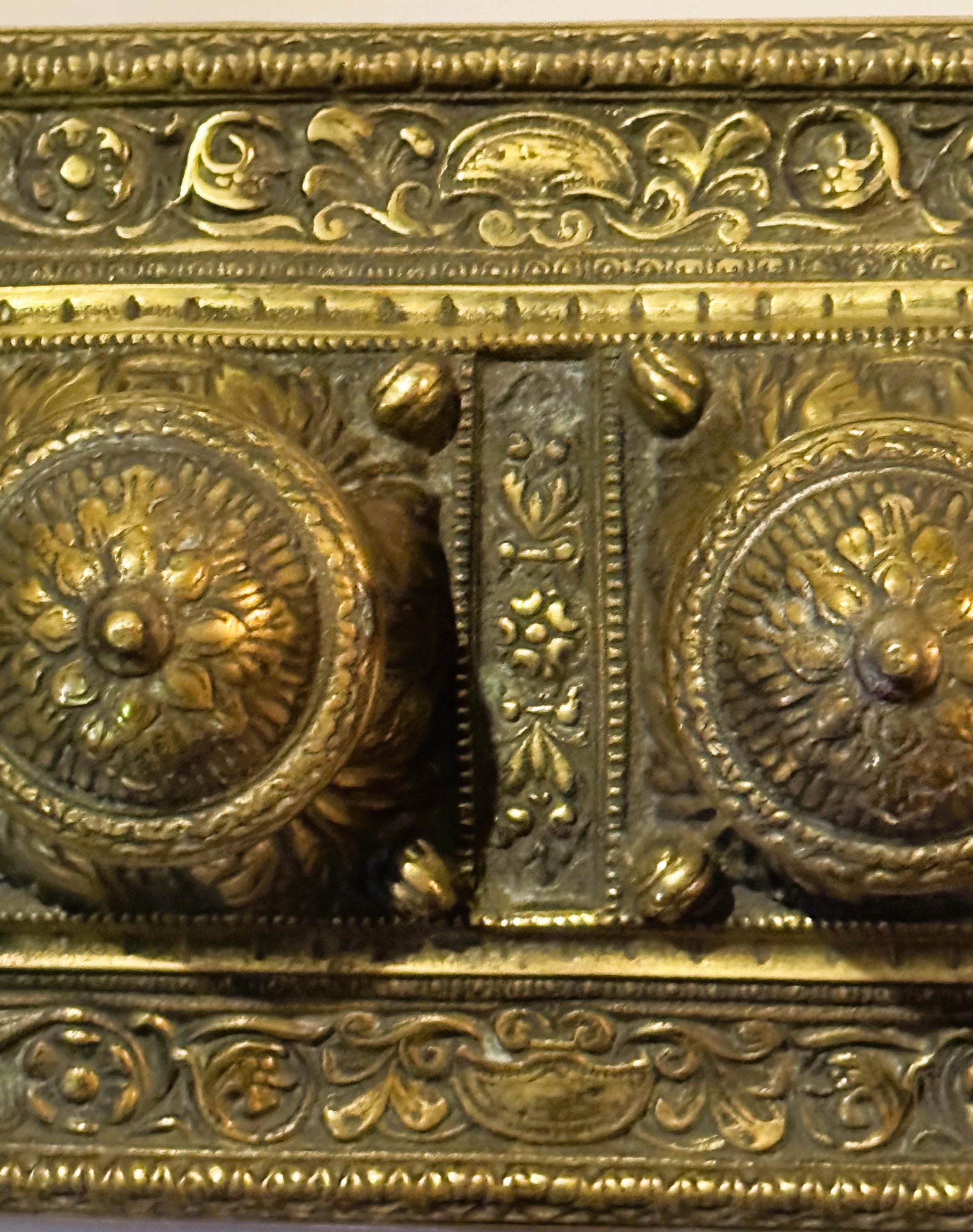 Ornate gold-toned metalwork on Late 19th Century Brass Double Inkwell Desk Accessory