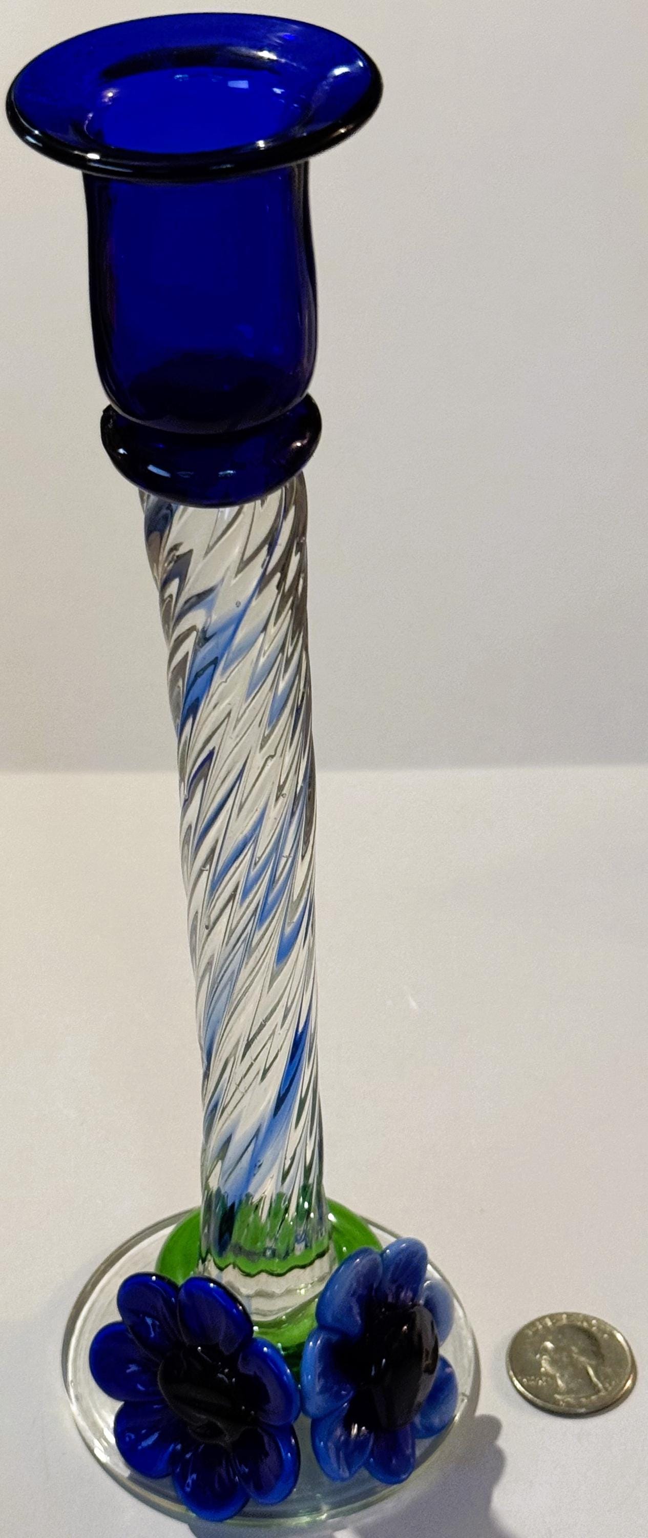 Tall blue glass candlestick with twisted clear and blue stem, dark blue base with applied blobs, topped with flared rim, show