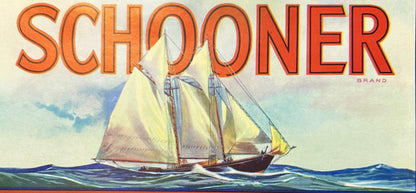 Antique Schooner Brand lemon crate label featuring large orange text above a two-masted sailing ship with cream-colored sails on blue ocean waves under a cloudy sky.