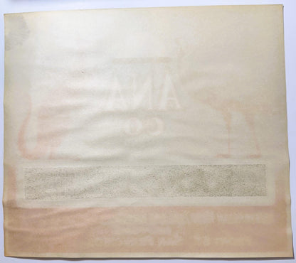 Back of the ANA CO Grape Fruit label: blank cream stock with the front's ANA CO lettering and animal art ghosting through in mirror image.