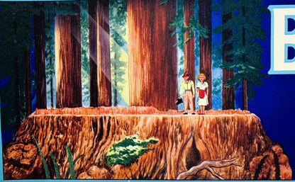 Vintage crate label showing two figures standing on a giant tree stump surrounded by tall redwoods, with colorful forest scen