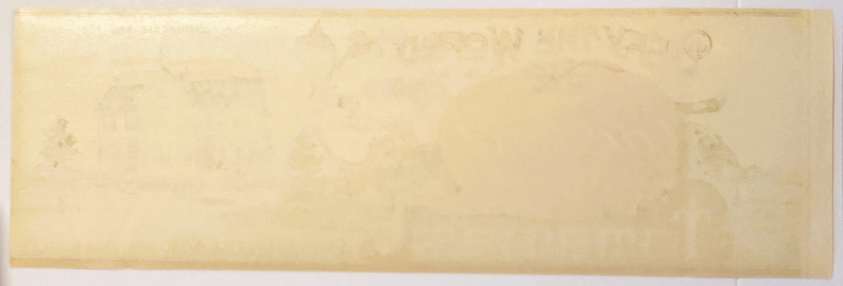 Aged cream-colored vintage tomato can label with faint printed text, showing wear and discoloration from age
