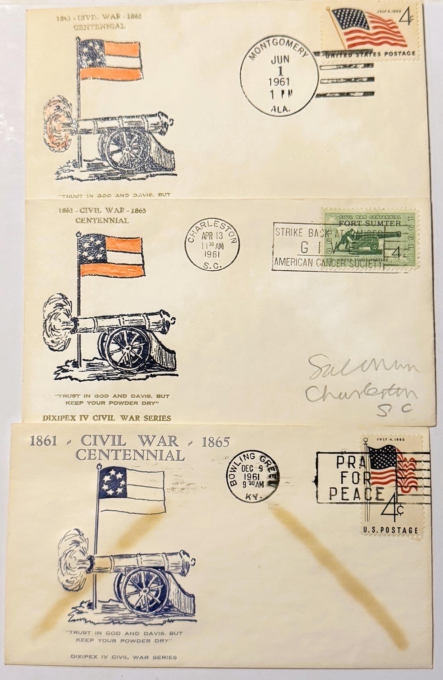 Three vintage 1961 Civil War Centennial first-day cover envelopes featuring cannon illustrations, patriotic flags, and postma