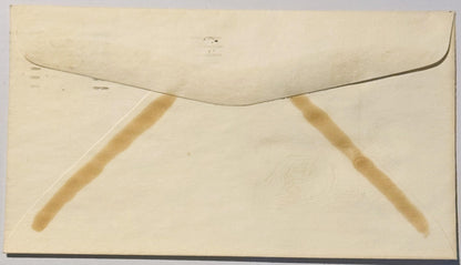 Cream-colored vintage envelope back showing triangular tan reinforcement strips and curved flap closure, photographed flat ag