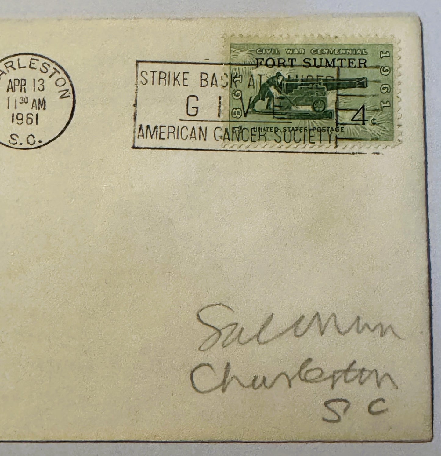Cream envelope with green Fort Sumter Civil War Centennial stamp, Charleston postmark dated April 13, 1961, and "Strike Back"