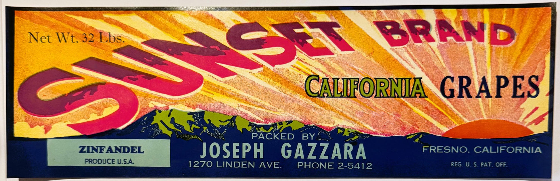 Vintage Sunset Brand California Grapes crate label with bold red and gold sunburst design, packed by Joseph Gazzara, Fresno, 