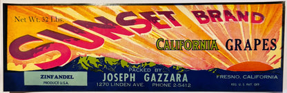Vintage Sunset Brand California Grapes crate label with bold red and gold sunburst design, packed by Joseph Gazzara, Fresno, 