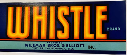 Vintage Whistle Brand crate label, glowing orange letters on dark blue. Text reads WHISTLE BRAND, PACKED BY WILEMAN BROS. & ELLIOTT INC., CUTLER, CALIFORNIA, U.S.A.