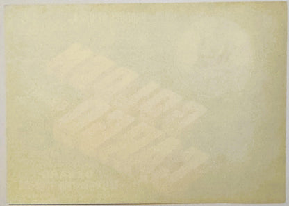 Blank cream-colored vintage crate label with faint watermark design, photographed flat against white background