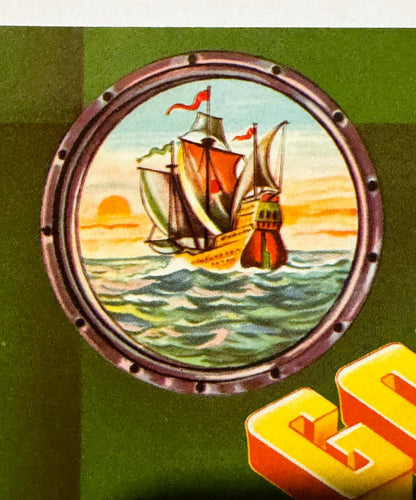 Vintage crate label featuring a sailing ship in a porthole frame against green background, with yellow and red shipping box v