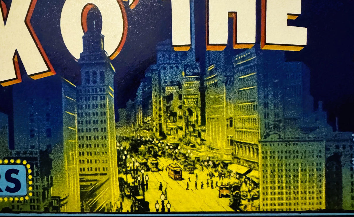 Vintage fruit crate label showing nighttime cityscape with illuminated buildings in yellow and blue, partial text "TALK O' TH