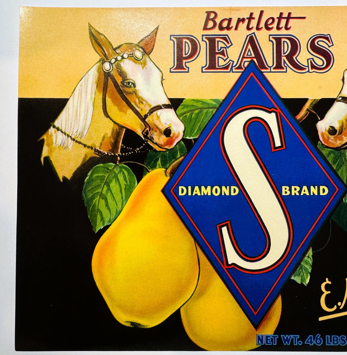 Antique Diamond S Brand Bartlett Pears crate label featuring a decorated horse's head and two golden pears with green leaves against a yellow and black background, net weight 46 lbs.