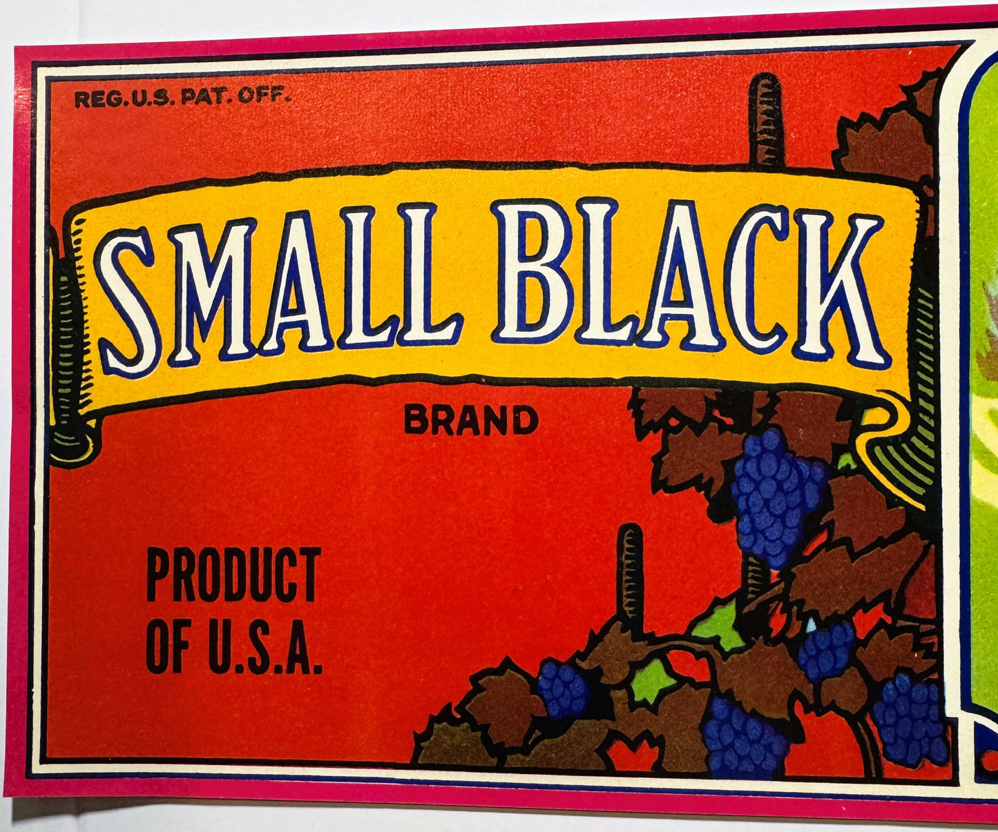 Vintage fruit crate label with yellow banner reading "SMALL BLACK BRAND" on red background, decorated with illustrated grape 