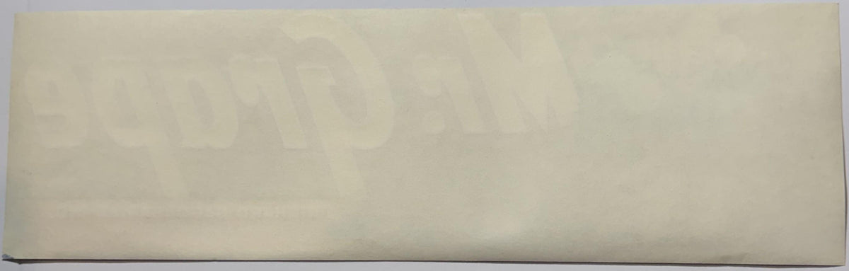 Pale cream-colored rectangular vintage crate label with faint printed text, photographed flat against white background
