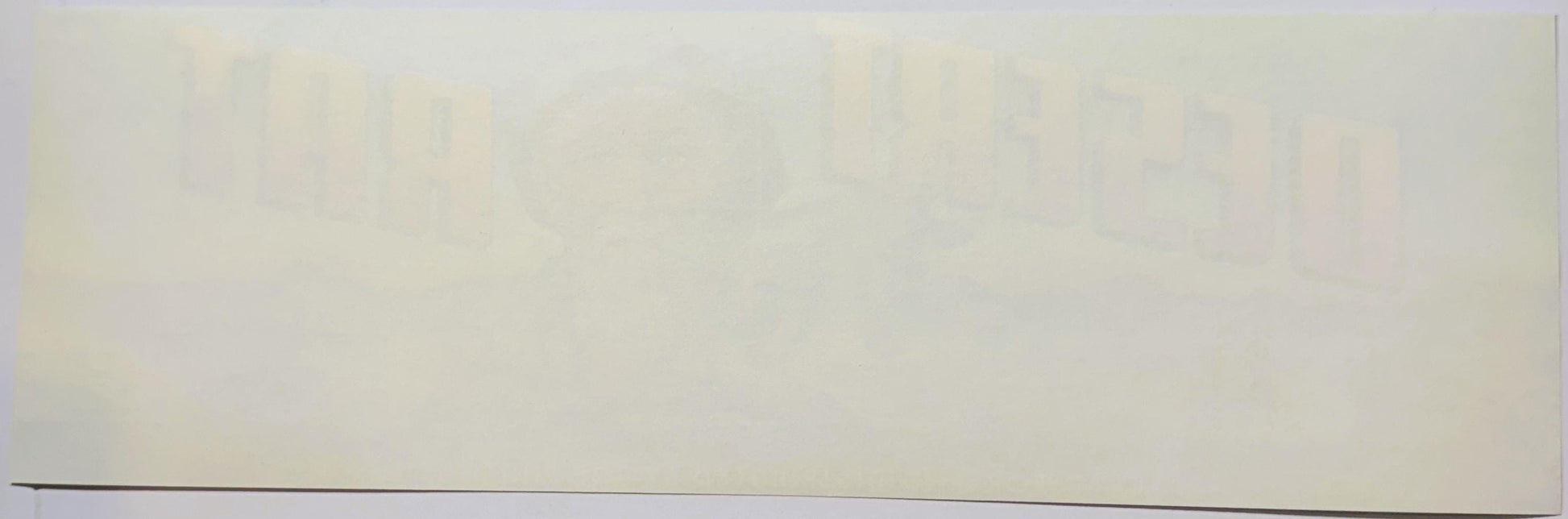 Faded vintage fruit crate label with tan and cream coloring, showing partial text and graphics against a light background, ph