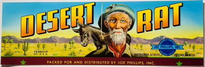 Vintage Desert Rat fruit crate label featuring bearded prospector with donkey in desert landscape, yellow and blue text, Joe 