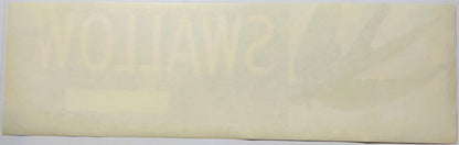 Cream-colored vintage crate label with faint printed text, photographed flat against a light background