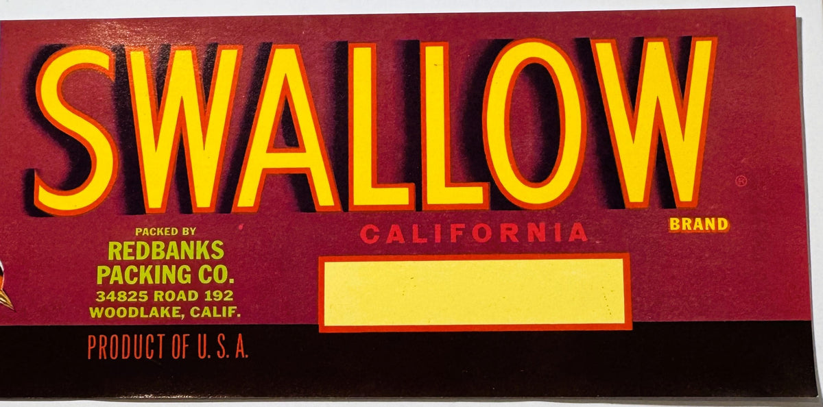 Vintage Swallow Brand fruit crate label with yellow text on red background, packed by Redbanks Packing Co.
