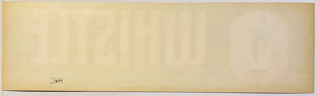 Vintage crate label with cream background and small brass steam whistle illustration in lower left corner, text reading "Whistle Brand" partially visible.