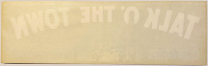 Faded vintage crate label with "Talk O' The Town" and "2" visible in embossed text on cream-colored paper, photographed flat