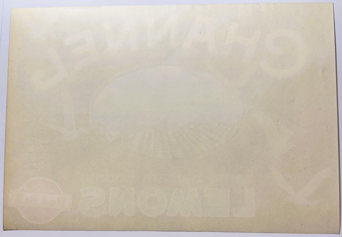 Cream-colored vintage citrus crate label with faint watermark logos and text, shown flat against light background