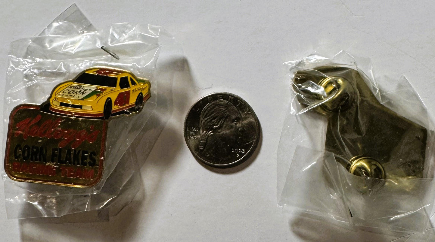 Vintage NASCAR pin with yellow race car and red Kellogg's Corn Flakes logo in clear plastic packaging, displayed next to a qu