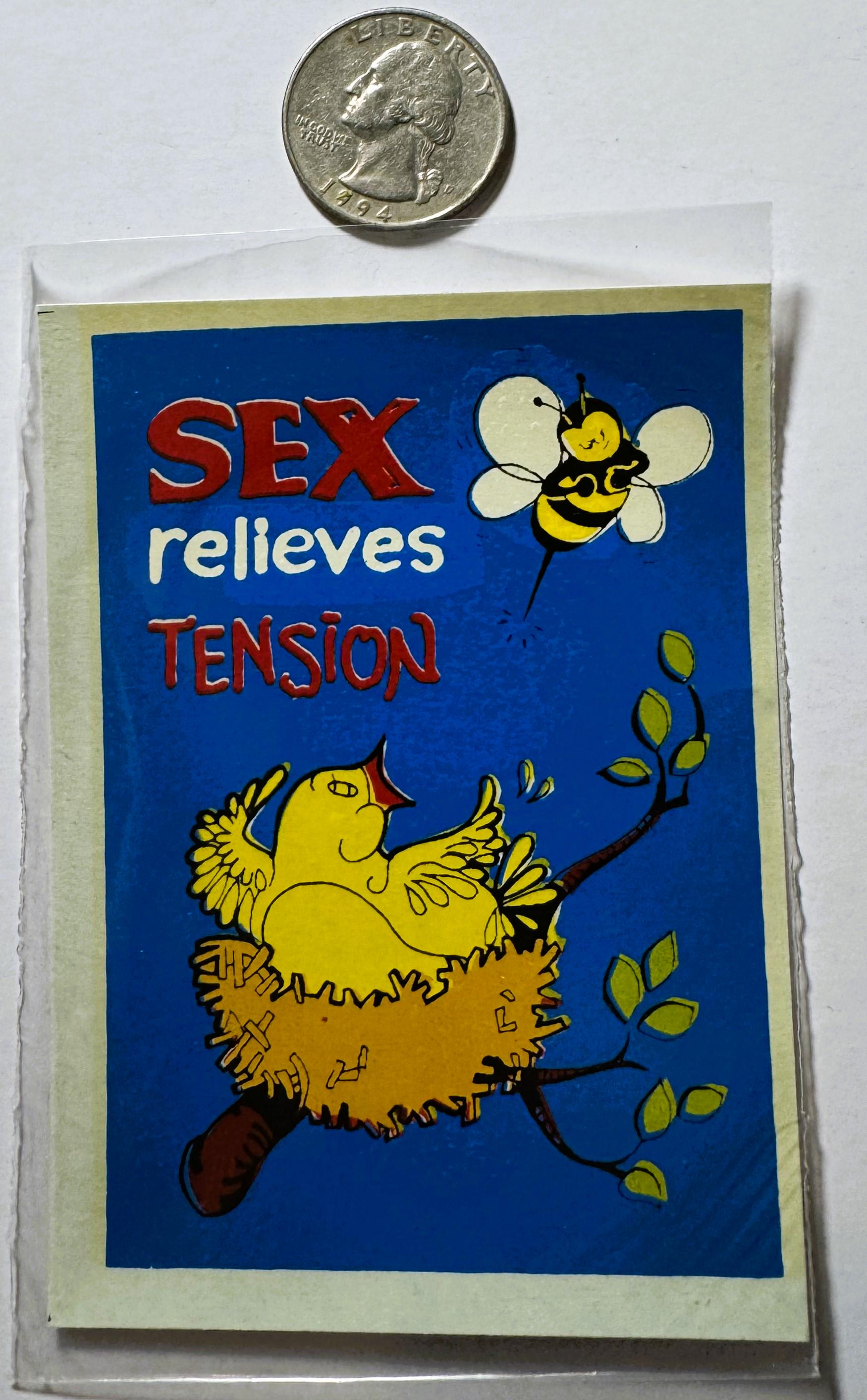 Vintage decal with yellow bird and bee on blue background, text reads "SEX relieves TENSION," quarter coin placed above for s