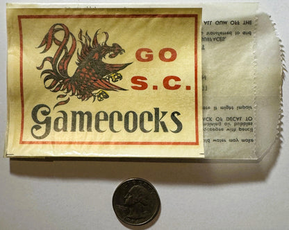 Vintage South Carolina Gamecocks water-transfer decal with red gamecock illustration on cream background, shown with quarter fo