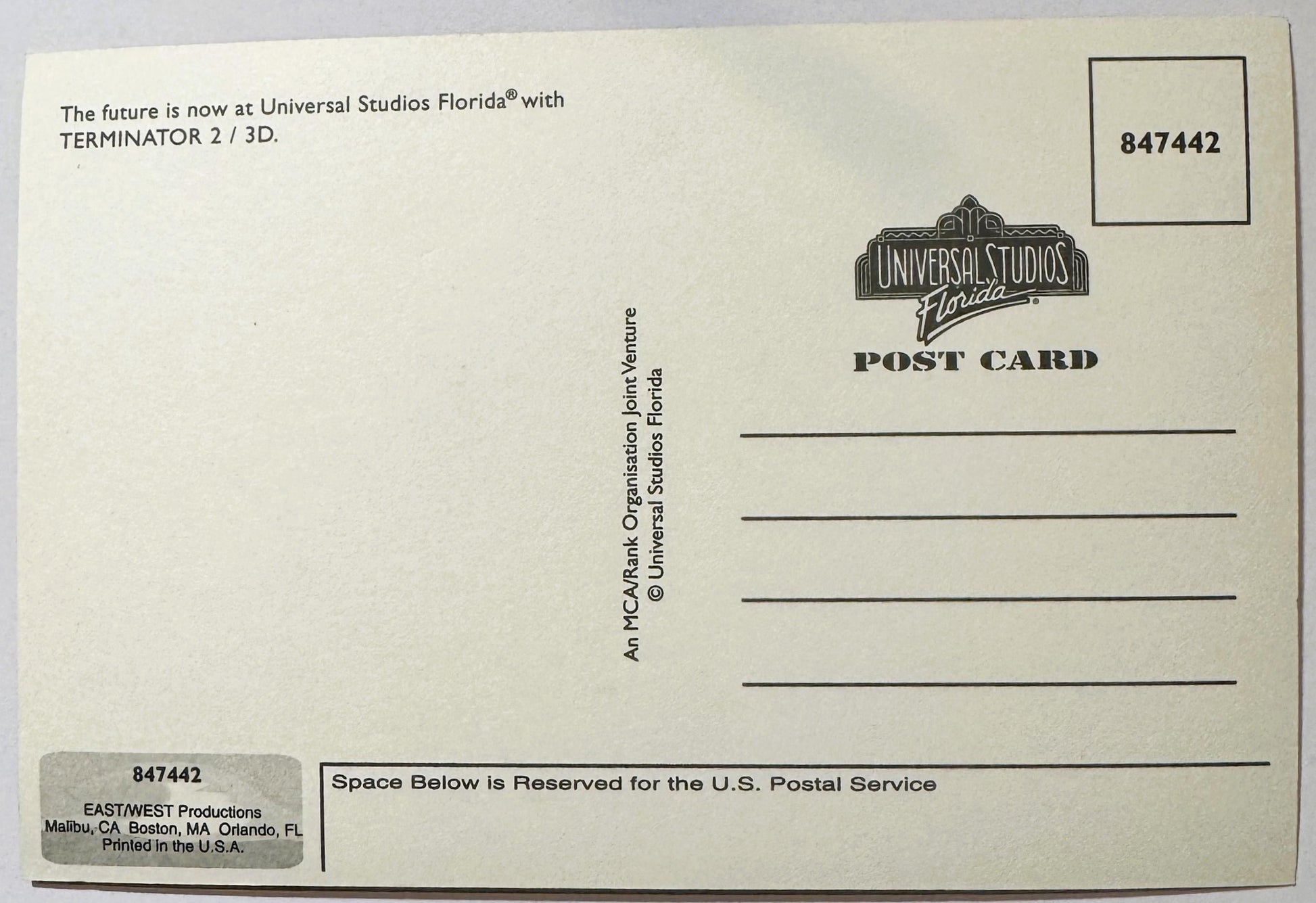 Back of vintage Universal Studios Florida postcard for Terminator 2: 3-D attraction, cream-colored with printed text and logo