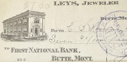 Antique bank check from Leys Jeweler in Butte, Montana, featuring First National Bank building illustration and handwritten a