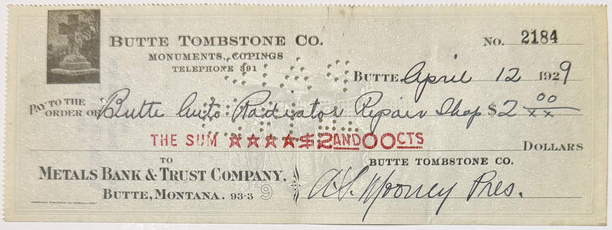 Vintage bank check from Butte Tombstone Co. dated April 12, 1929, with handwritten details and red printed amount stamp, on c